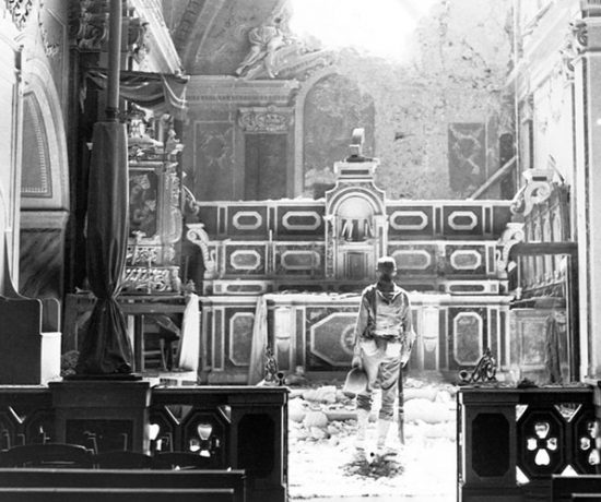 soldier in a damaged church in Acerno, Italy